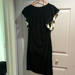Ralph Lauren, Black dress with white and black ruffle over the arms.